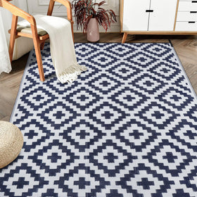SAND MINE reversible mat on patio in dark blue and white for outdoor ambiance
