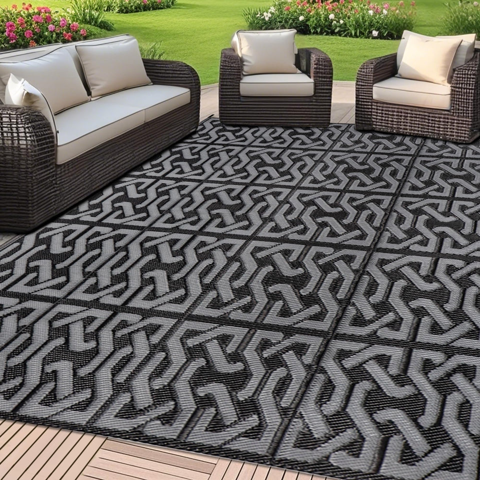 SAND MINE reversible mats on a sunlit patio, ideal for outdoor lounging