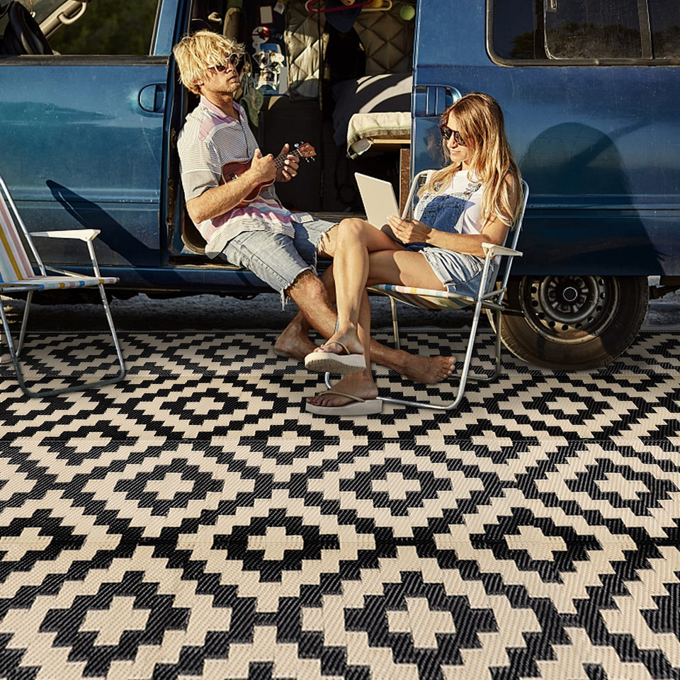 SAND MINE waterproof outdoor rug 9x18 laid out on patio with furniture