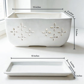 Sanmudecor orchid pot on a windowsill for tidy drainage.