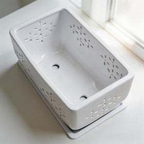Sanmudecor white ceramic orchid pot features floral cutouts and airflow.
