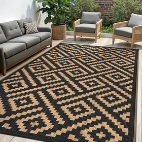 Sarben outdoor rug 10x14 in black and brown creates a comfortable patio space.