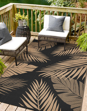Sarben outdoor rug with palm leaf design for patios and decks.