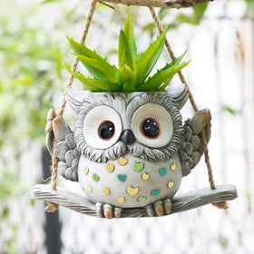 Saysmile Swing Owl Planter hanging indoors for a charming plant display.