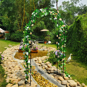 SCENDOR garden arbor lit with fairy lights for magical evening ambiance.