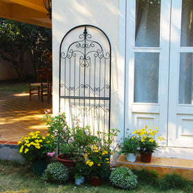SCENDOR Garden Trellis with ornate scrollwork supporting climbing plants