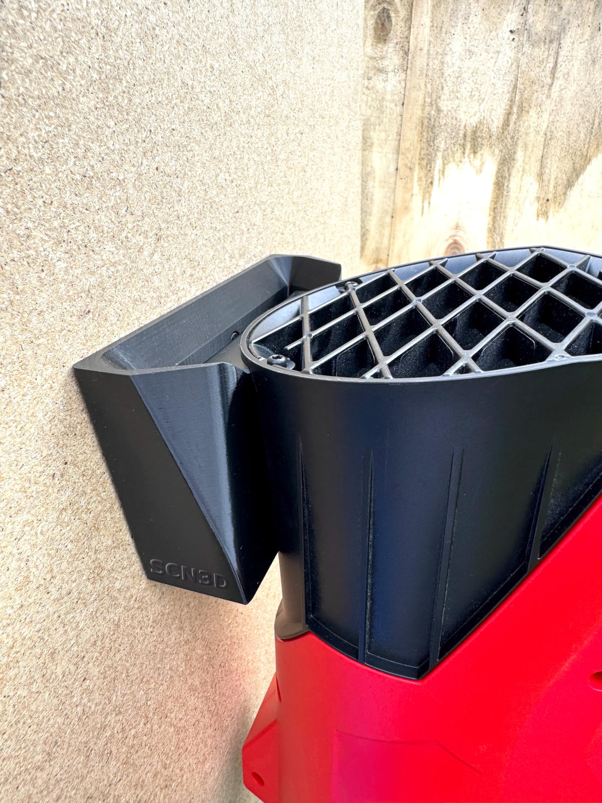 SCN3D wall mount helps organize the garage by keeping tools off the floor.