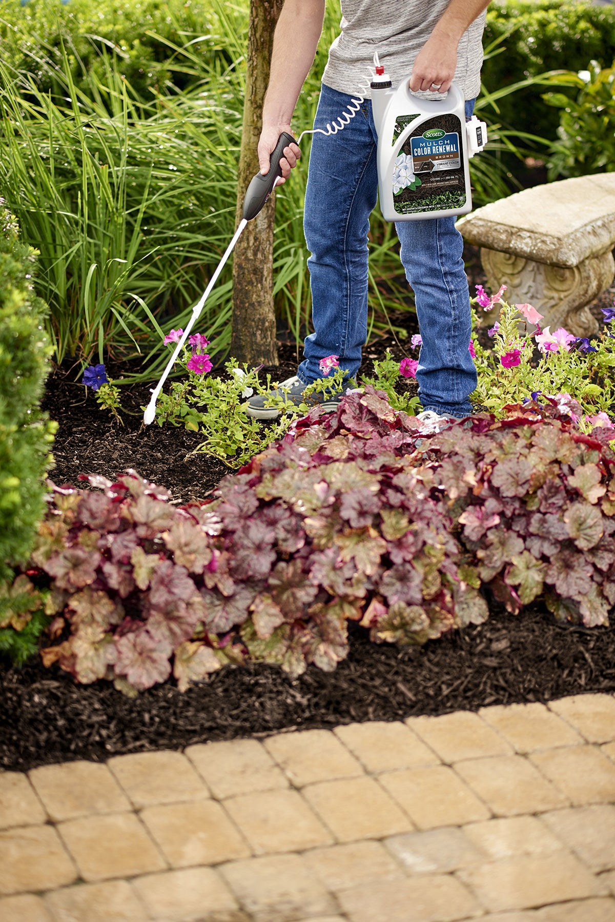 Boosted curb appeal by renewing brown mulch with Scotts product.