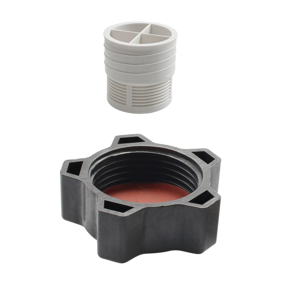 Screw Man drain cap gasket close-up showing debris prevention in the piping.