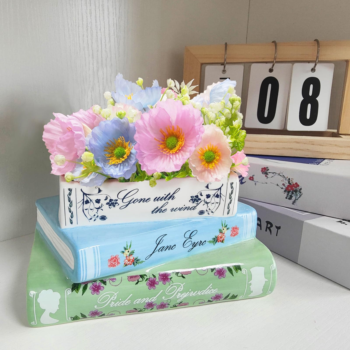 Scuyari book vase on shelf creates charming focal point for living room.