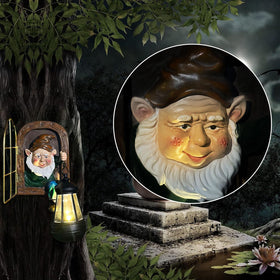 Scuyari yard art gnome lantern hanging from a tree for soft glow.