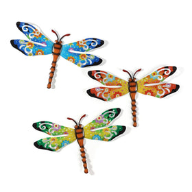 Scwhousi metal dragonfly wall decor on a fence adds vibrant outdoor charm.