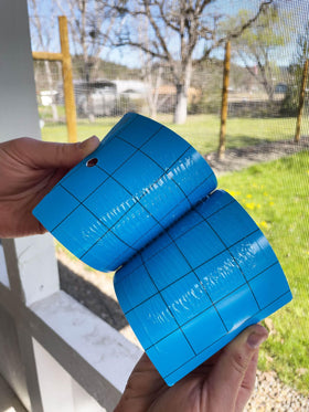 Seabright blue sticky trap with grid aids growers in monitoring pest levels along crop rows.