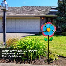 Senflame wind spinner stakes secured in soil for outdoor display