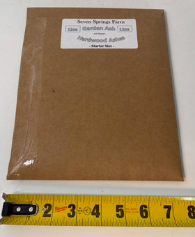 Seven Springs Farm ash packaging 12oz label in view.