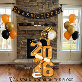 Sewrung outdoor indoor congrats sign enhances party decor.
