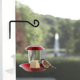 Sexoeie bird feeder hanger keeps feeders securely displayed on walls.