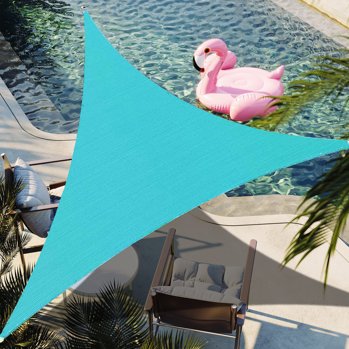 Shadespeare turquoise triangle shade sail over backyard provides cool shade and style.