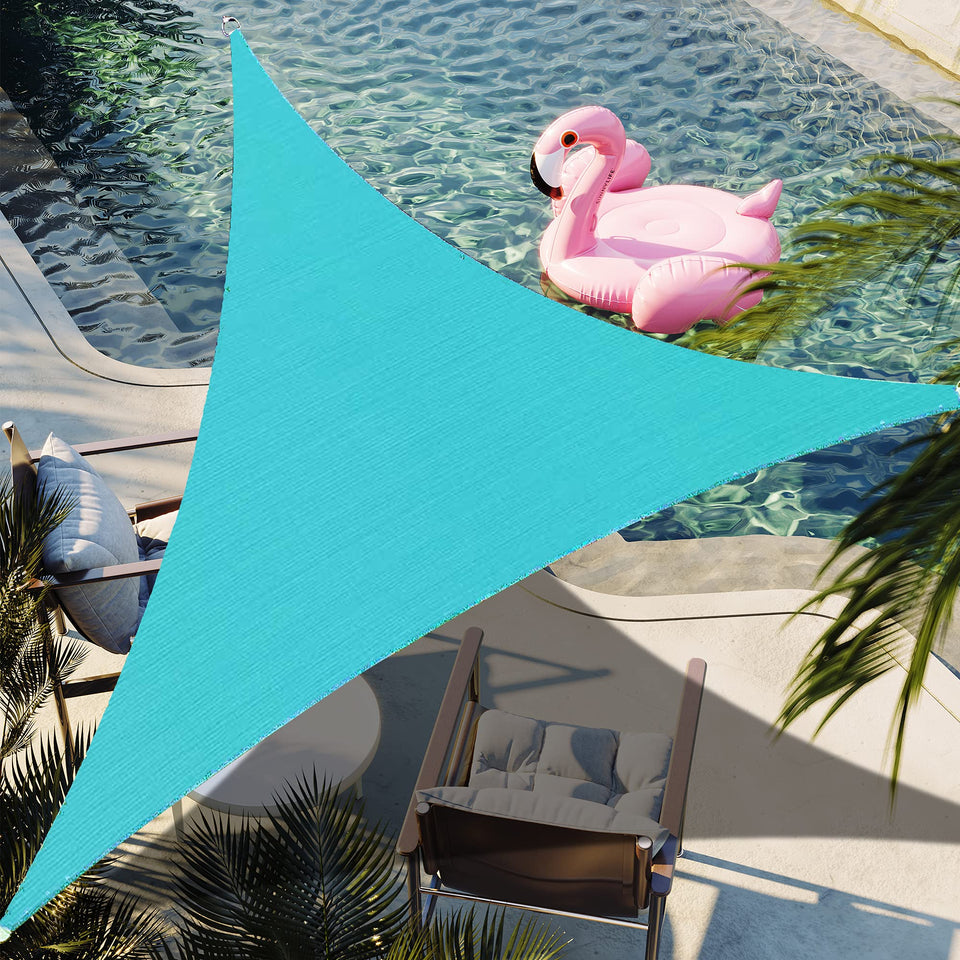 Shadespeare turquoise triangle shade sail over backyard provides cool shade and style.