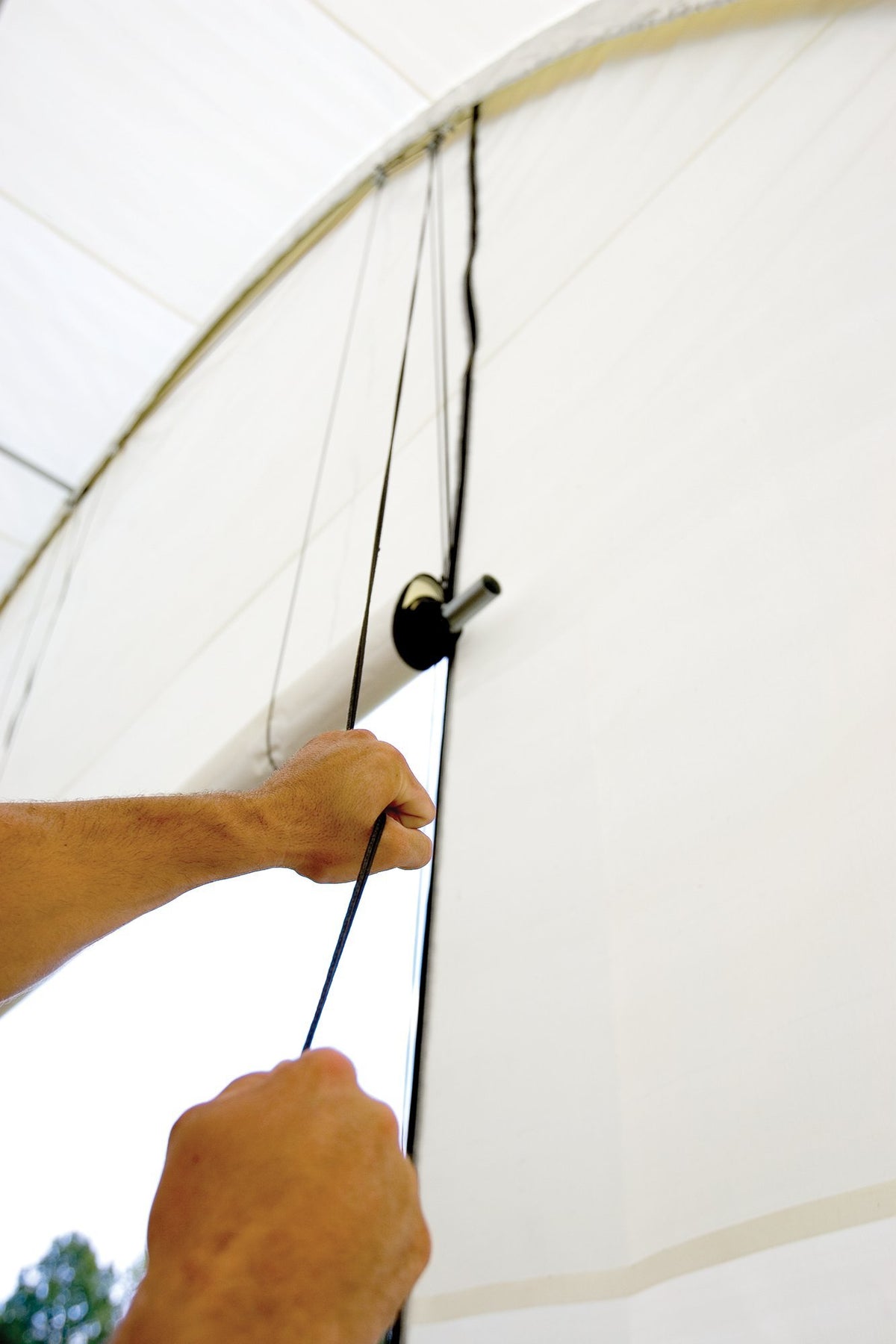 ShelterLogic Pull-Eaze door kit installed on a shelter.