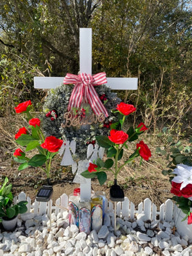 SHINCEL memorial cross cemetery display in a serene outdoor setting.