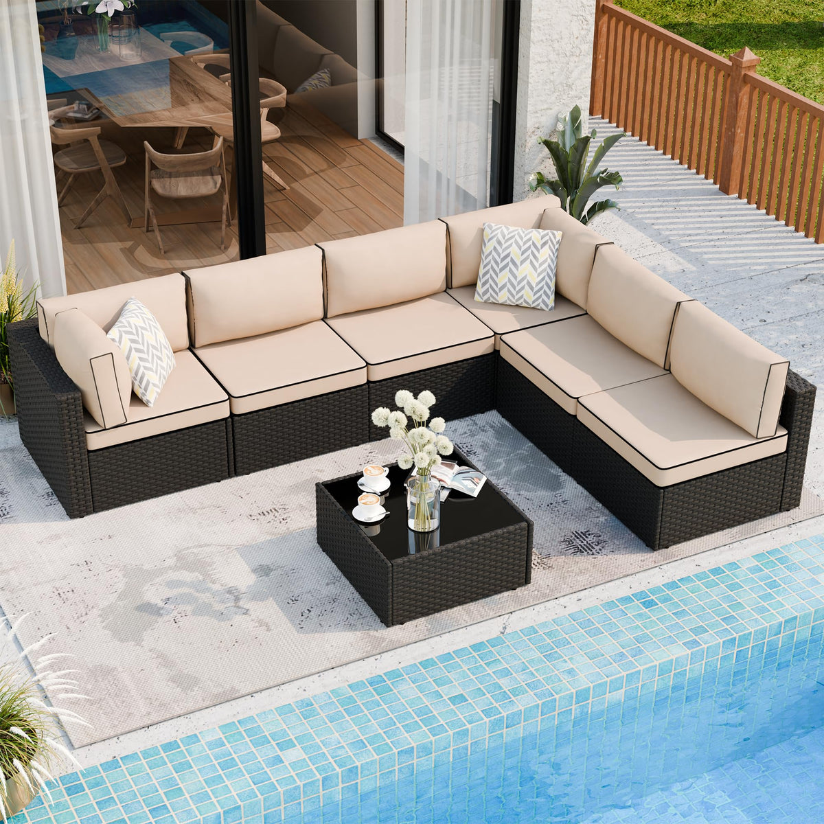 Shintenchi outdoor wicker sofa with glass-top side table for entertaining guests.