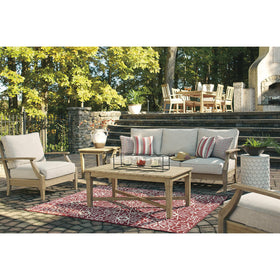 Signature Design by Ashley Clare View outdoor sofa with four throw pillows enhances patio seating.