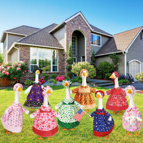 Silicherry Christmas goose outfit with candy motifs on porch statue