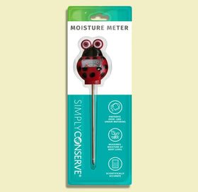 Simply Conserve Ladybug moisture meter shown indoors with a potted plant.