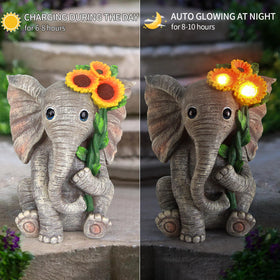 Sinhra yard art elephant statue enhances curb appeal at front porch.