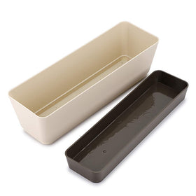 Skelang rectangular planter with drainage hole and removable saucer tray for mess-free watering.