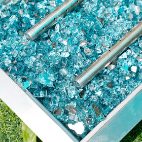 Skyflame aqua blue fire glass used as landscaping accent with shimmering appeal
