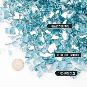 Skyflame aqua blue reflective fire glass in a firepit creating vibrant ambiance