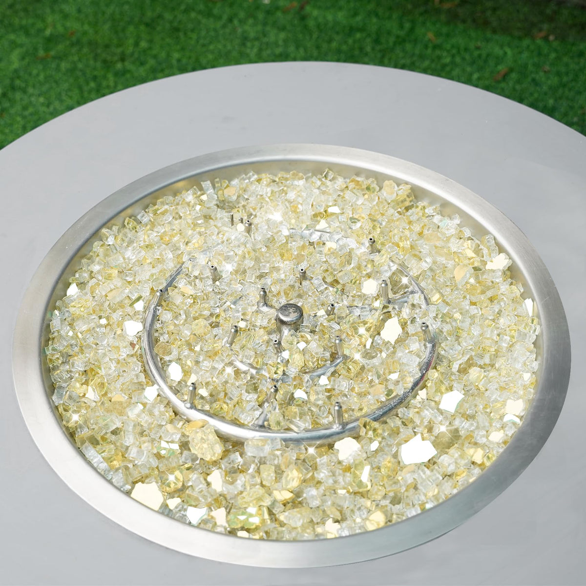 Skyflame fire pit setup with glass rocks and accessories.