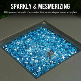 Skyflame Pacific Blue fire glass used in outdoor landscaping for shimmering edges.