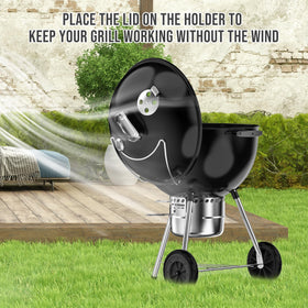 Skyflame wind-blocker lid holder shields charcoal on breezy days.