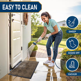 Smiry mat easy-clean feature shown with broom and hose.