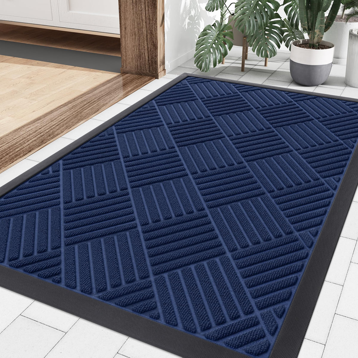 Smiry navy front door mat at outdoor entrance traps dirt and moisture.