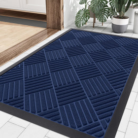Smiry navy front door mat at outdoor entrance traps dirt and moisture.