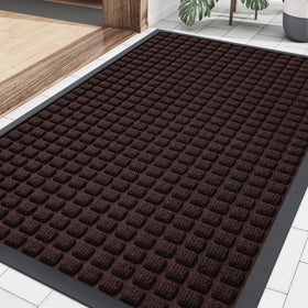 Smiry front door mat with woven surface traps dirt and moisture.