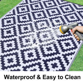 Smiry reversible pattern rug offers two color options for versatile outdoor styling
