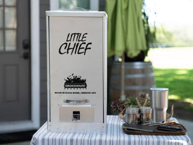 Smokehouse Little Chief Front Load Smoker with removable wood chip pan enabling flavor adjustments.