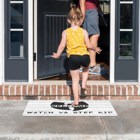 SNNDER Doormat catches dirt and moisture on a covered porch.