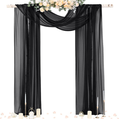 Socomi black sheer Gothic draping on an arch creating an elegant wedding backdrop.