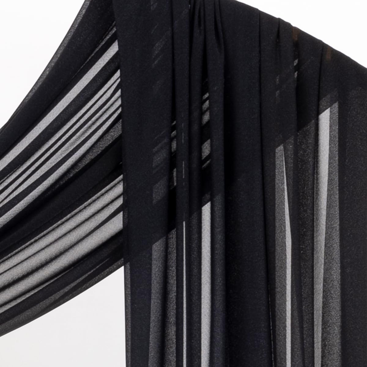 Socomi black sheer fabric enhancing reception decor and baby shower setup.