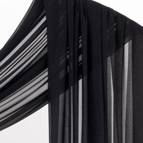 Socomi black sheer fabric enhancing reception decor and baby shower setup.