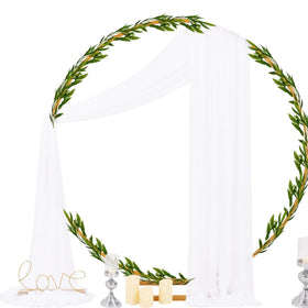 Socomi white sheer arch draping fabric panel draped over arch for romantic floor-sweeping folds.