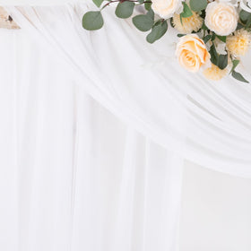 Socomi white sheer arch draping fabric panel rolled to create soft backdrop swags.