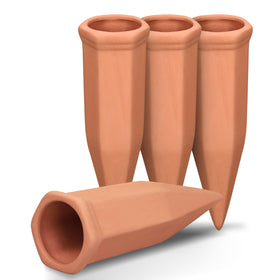 Soilagua terracotta watering spike in use with a wine bottle delivering steady moisture to the root zone.