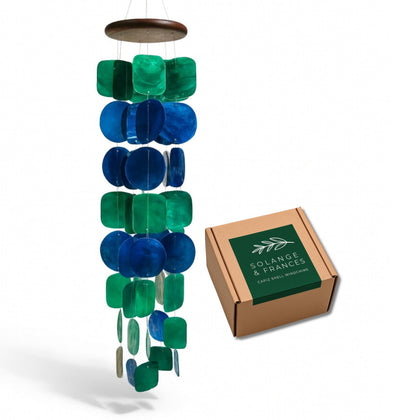 Solange & Frances capiz wind chimes for outdoor spaces offer a delicate, soothing breeze.